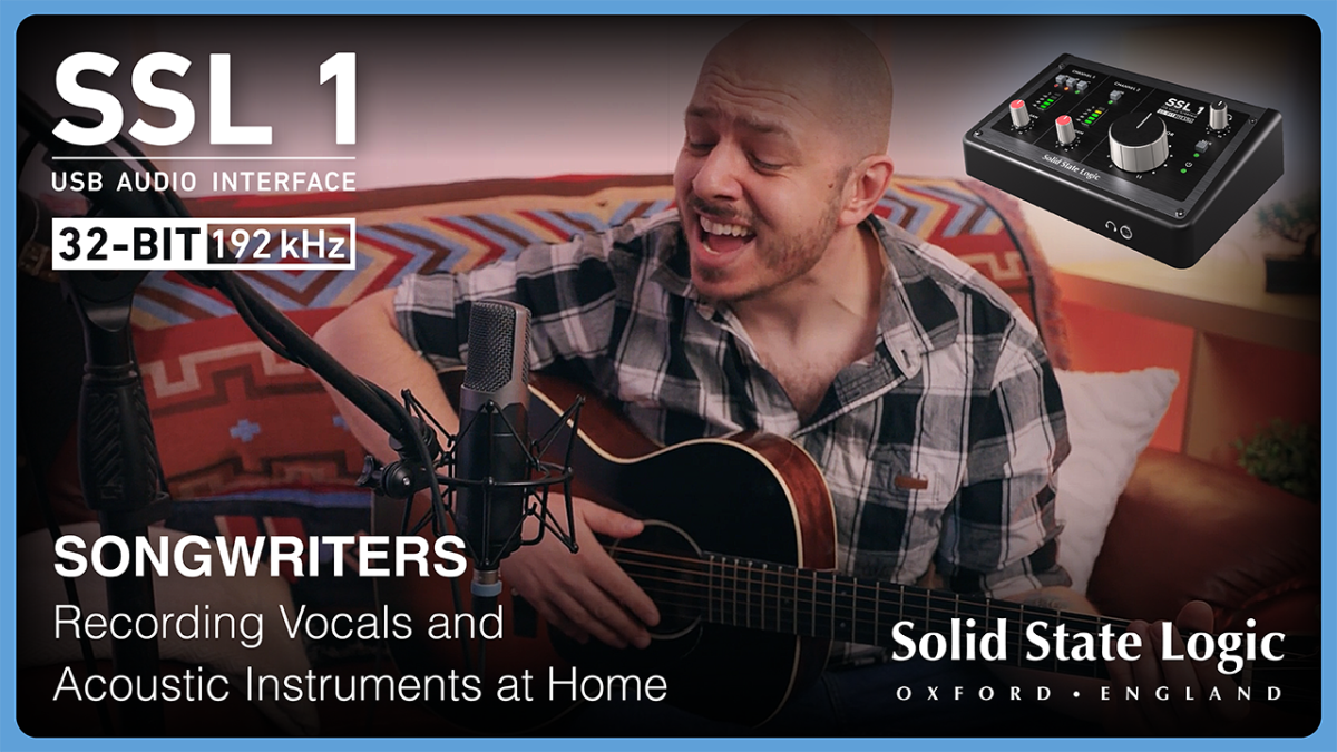 Singer Songwriter recording guitar with SSL1